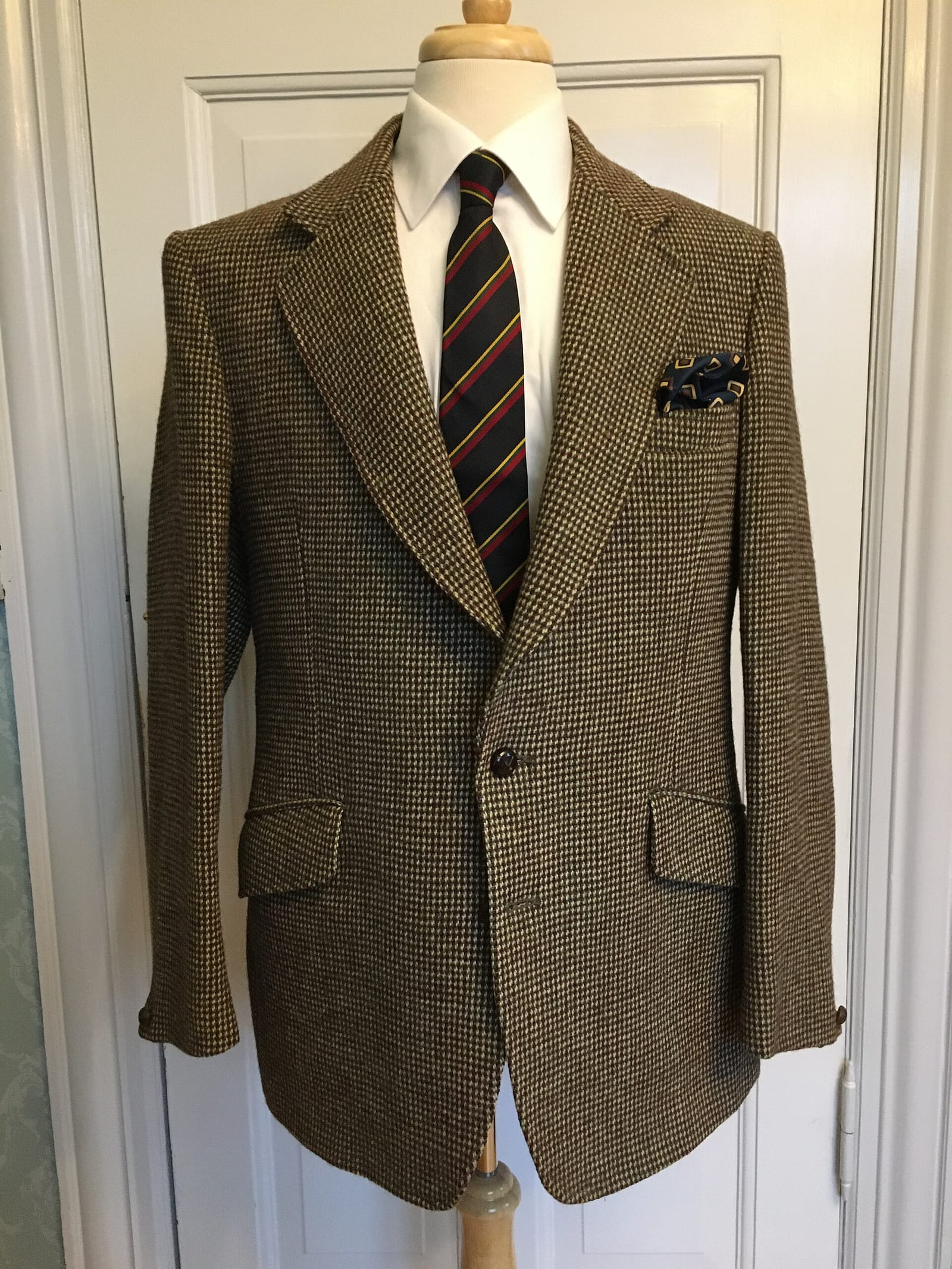 Herringbone Harris Tweed jacket on a mannequin.